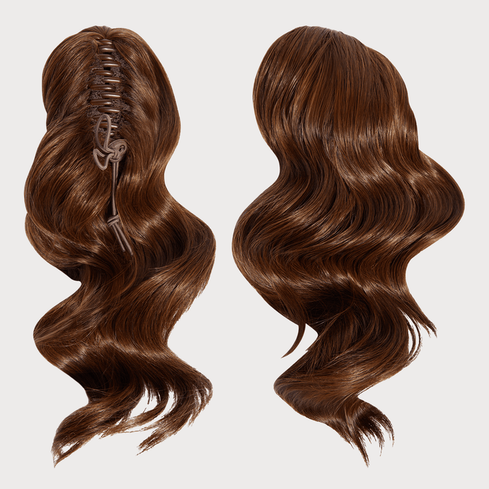 Brown hair extension with a comb on a white background